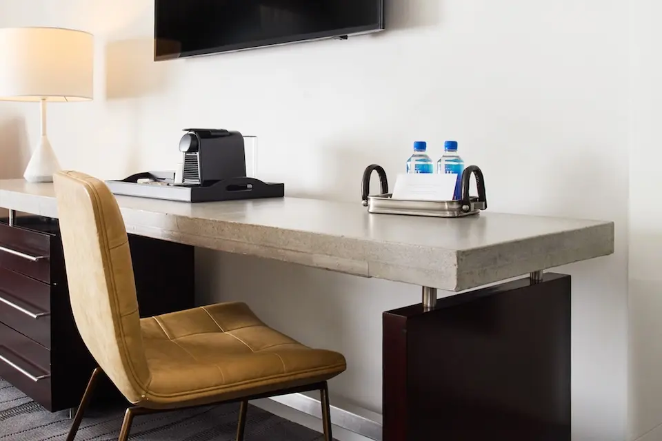 Balcony King - oversized desk with seating and wall-mounted TV