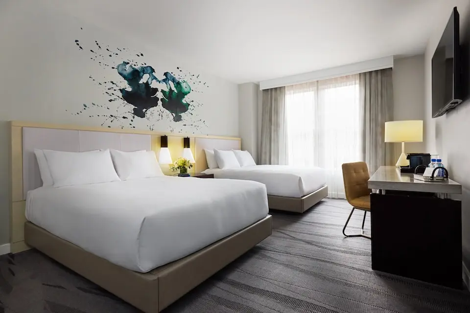 Double Queen - two queen beds with oversized desk and ombré art wallcovering