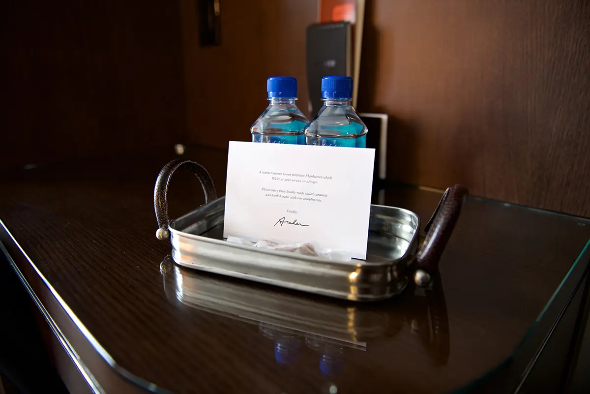 Welcome amenity of complimentary water, salted caramels and card