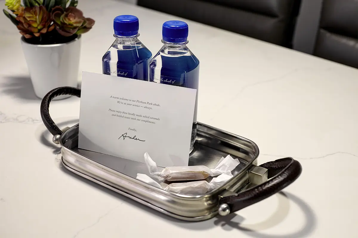 Welcome amenity of complimentary water, salted caramels and card