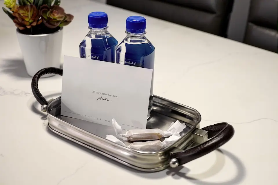 Welcome amenity of complimentary water, salted caramels and card