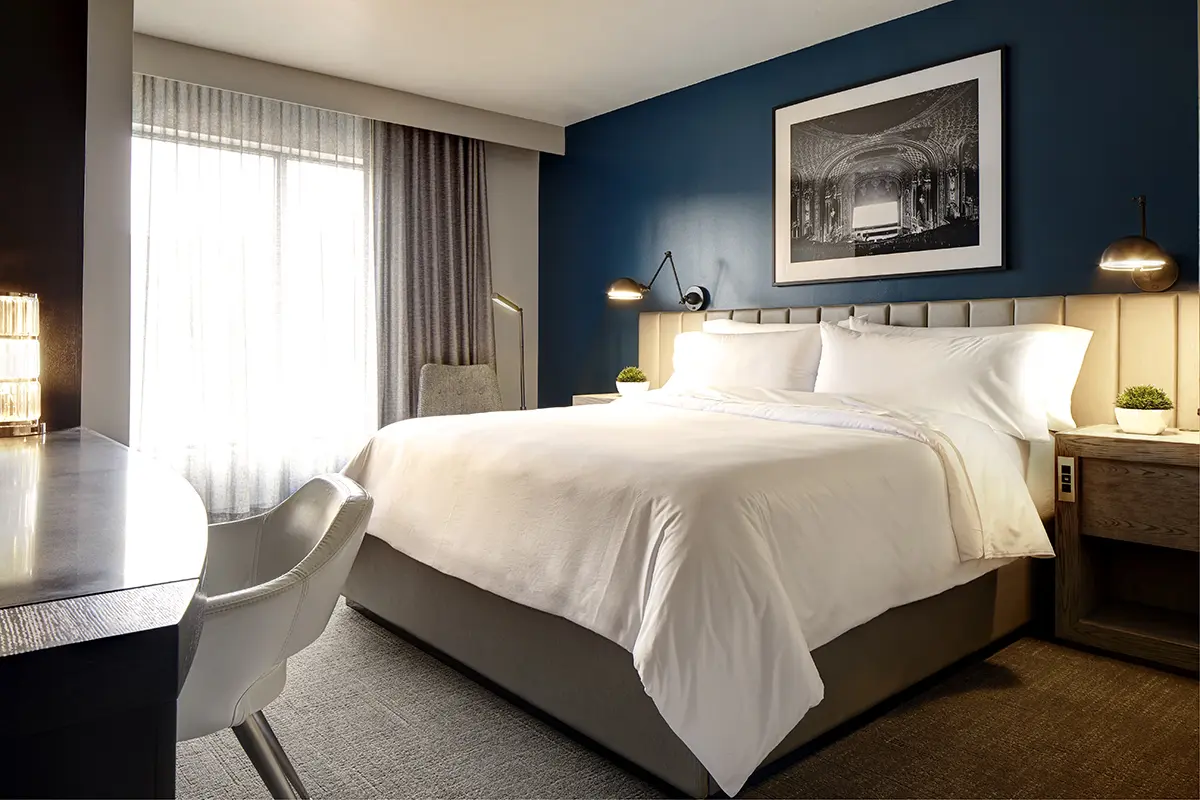 Classic King - platform bed with white five-star bedding and custom end tables