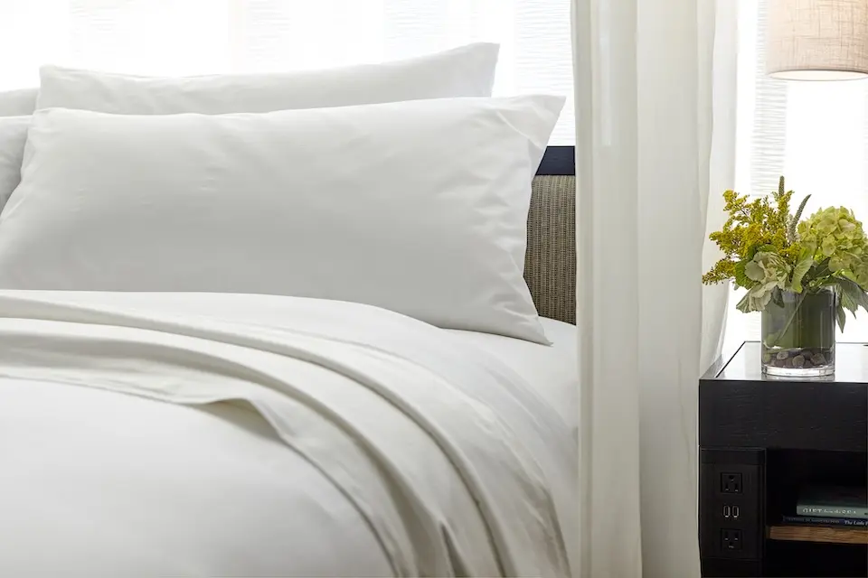 Archer's Den - white bedding detail