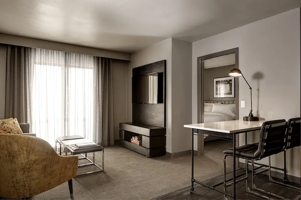 Archer's Den - separate living area with wall-mounted TV and movable island