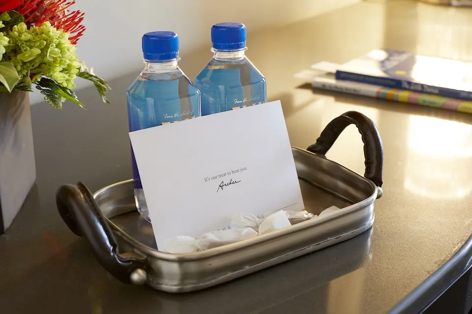 Welcome amenity of complimentary water, salted caramels and card