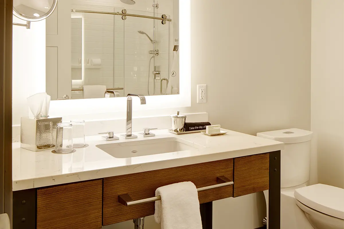 Modern bathroom with weathered iron vanity and mirror