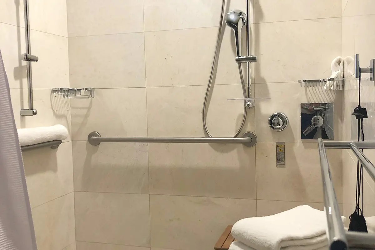 Archer King Suite - mobility-accessible roll-in shower with shower seat and grab bars