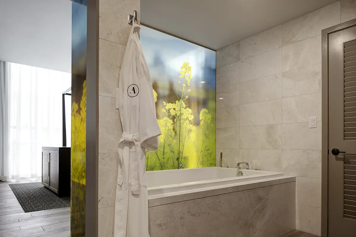 Archer's Den - soaking tub with a frosted bathroom wall shrouded by Napa mustard fields