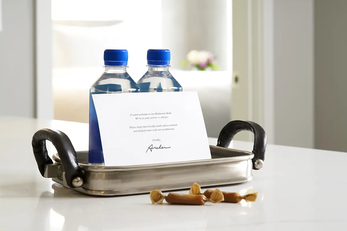 Welcome amenity of complimentary water, salted caramels and card
