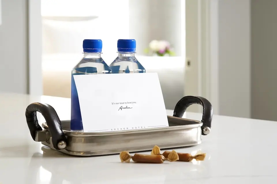 Welcome amenity of complimentary water, salted caramels and card