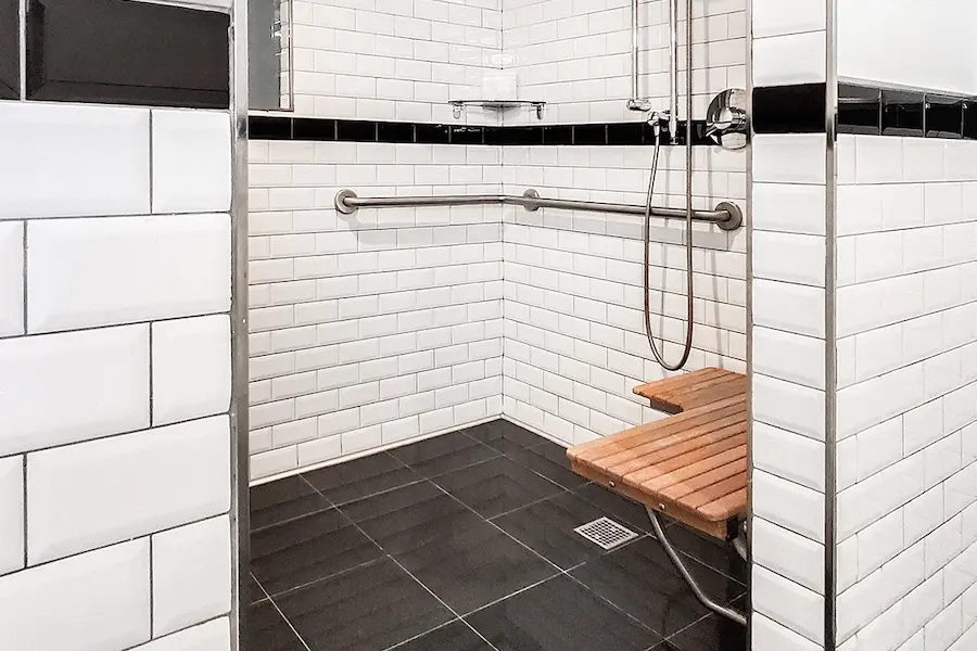 Classic Queen - spacious mobility-accessible roll-in shower with shower seat, grab bars and hand-held shower wand