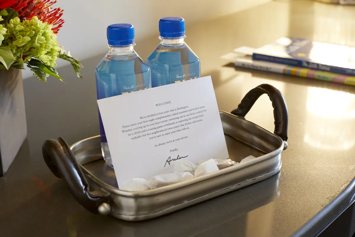 Welcome amenity of complimentary water, salted caramels and card
