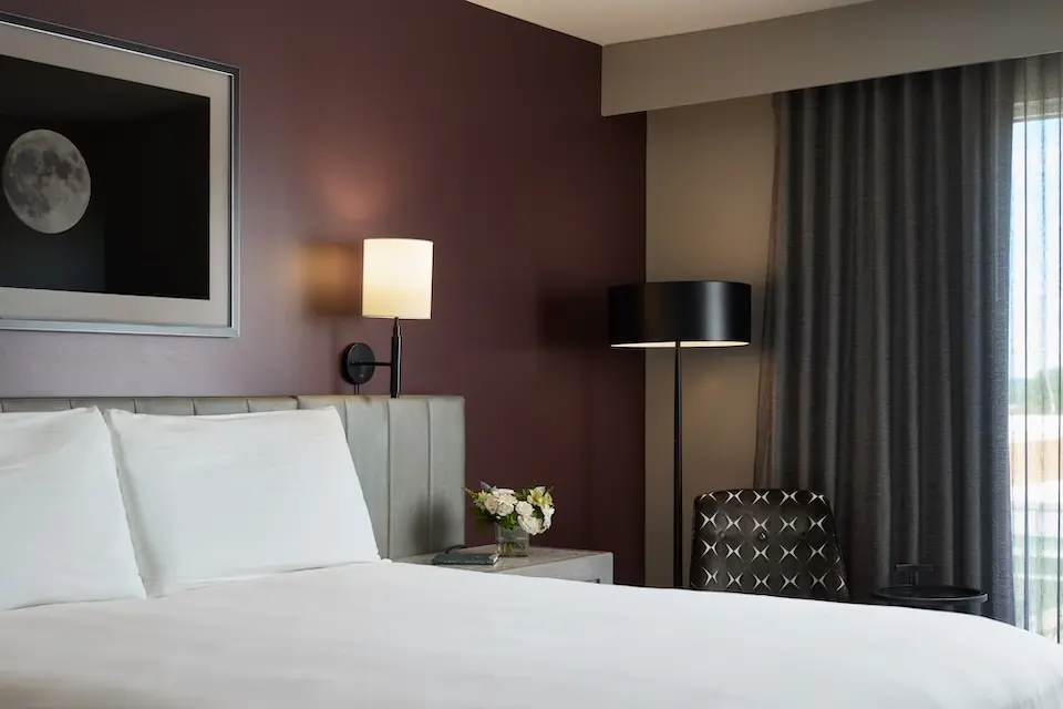 Classic King - platform bed with brandy-colored accent wall and channel-tufted headboard