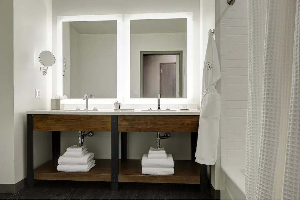 Double King - modern bathroom with a quartz double vanity and mirrors