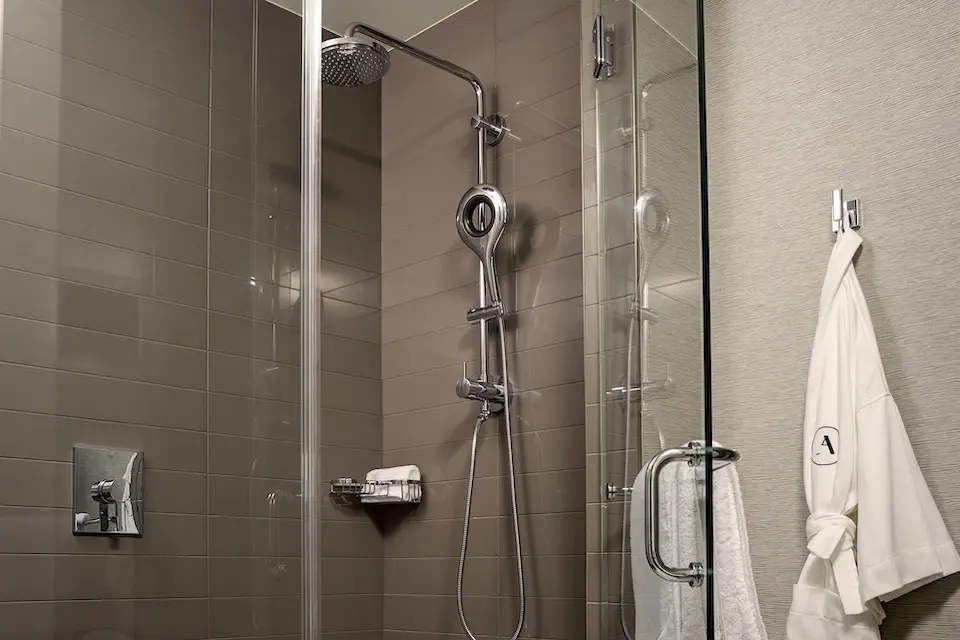 Archer King Suite - bathroom walk-in shower and hanging Frette bathrobe