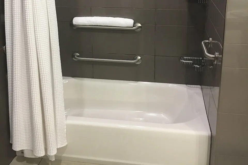 Classic King - mobility-accessible bathtub with grab bars and hand-held shower wand