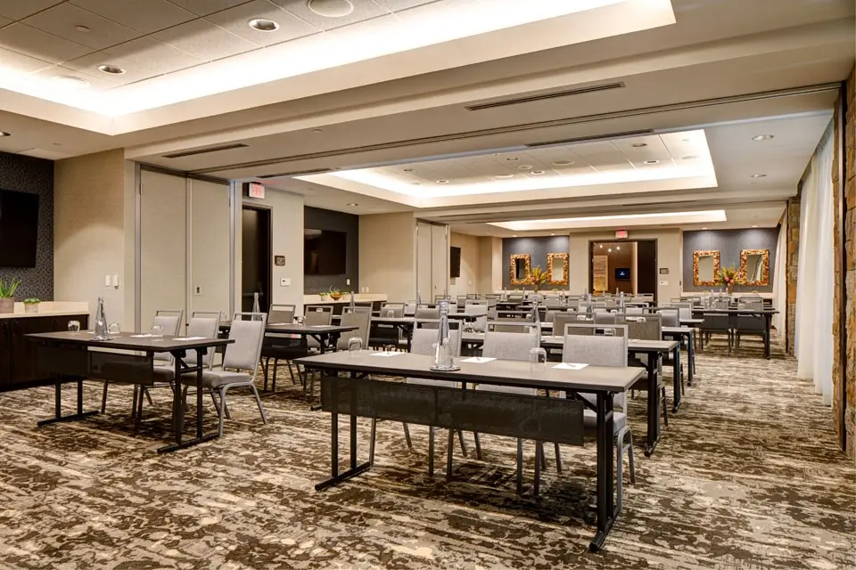 Great Room C set up with tables for conference space
