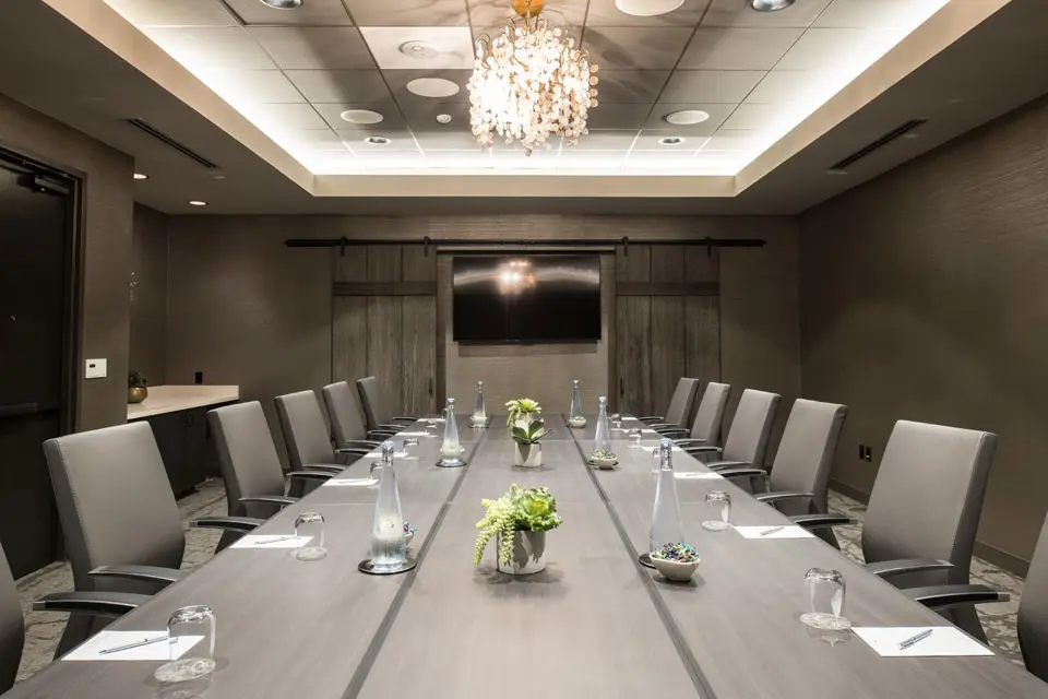 Archer Hotel Napa Krug Salon Board Meeting Setting with Flowers