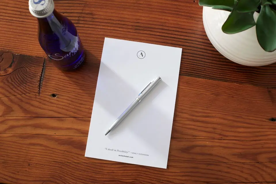 Archer Hotel Burlington notepad with pen and water