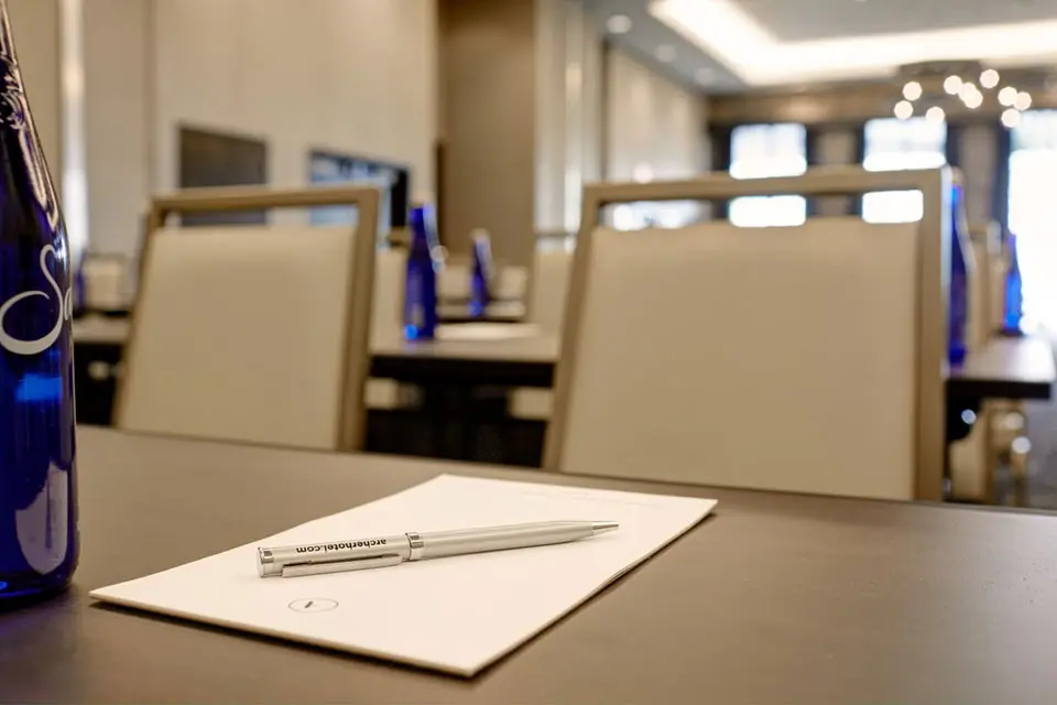Archer Hotel Florham Park - Blue water bottle with notepad and a pen