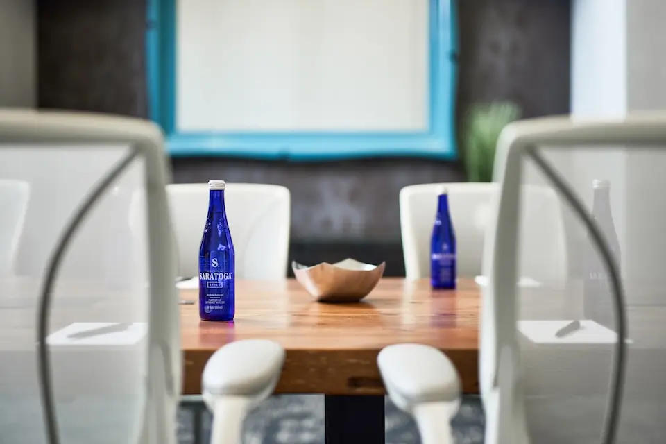 Archer Hotel Florham Park - Boardroom table with water and notepads