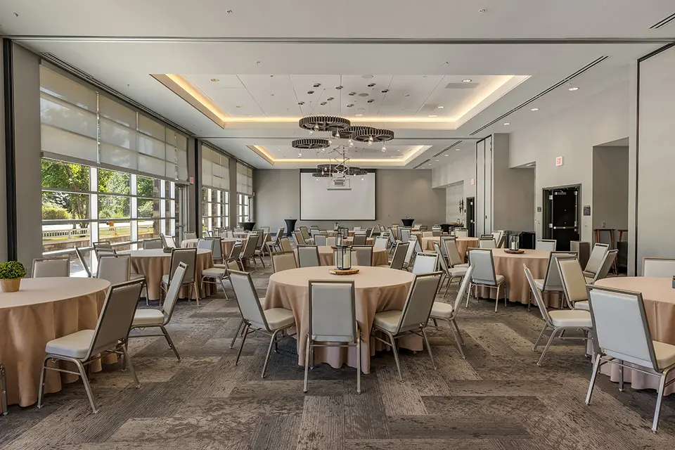 Archer Hotel Redmond - social event with beige table covers