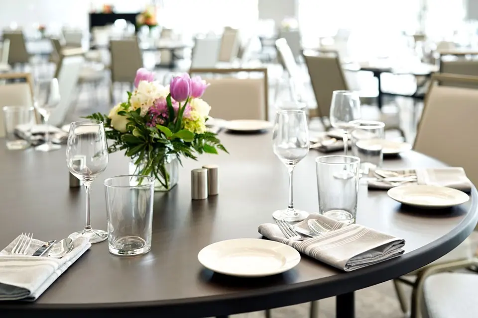 Table setup with flowers, glasses and plates