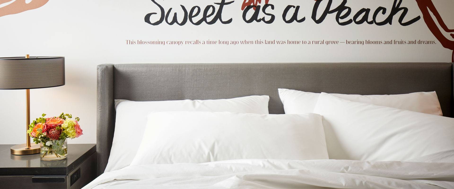 Archer Hotel Tysons bed detail with bedside table