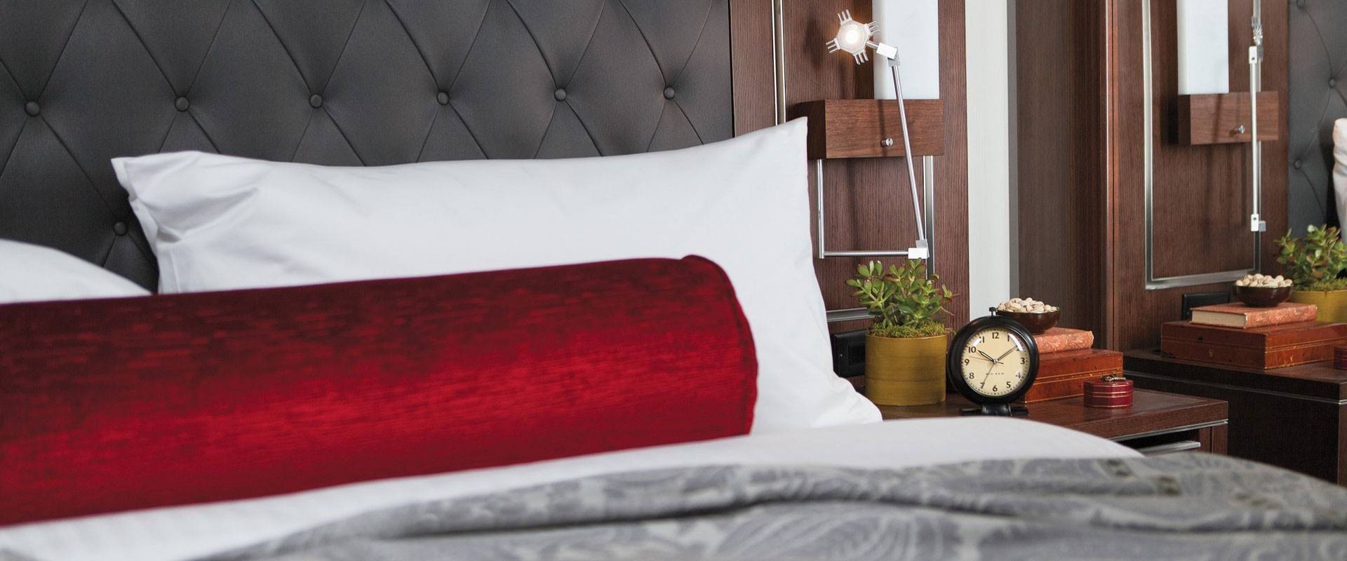 Bed detail with side table and lamp